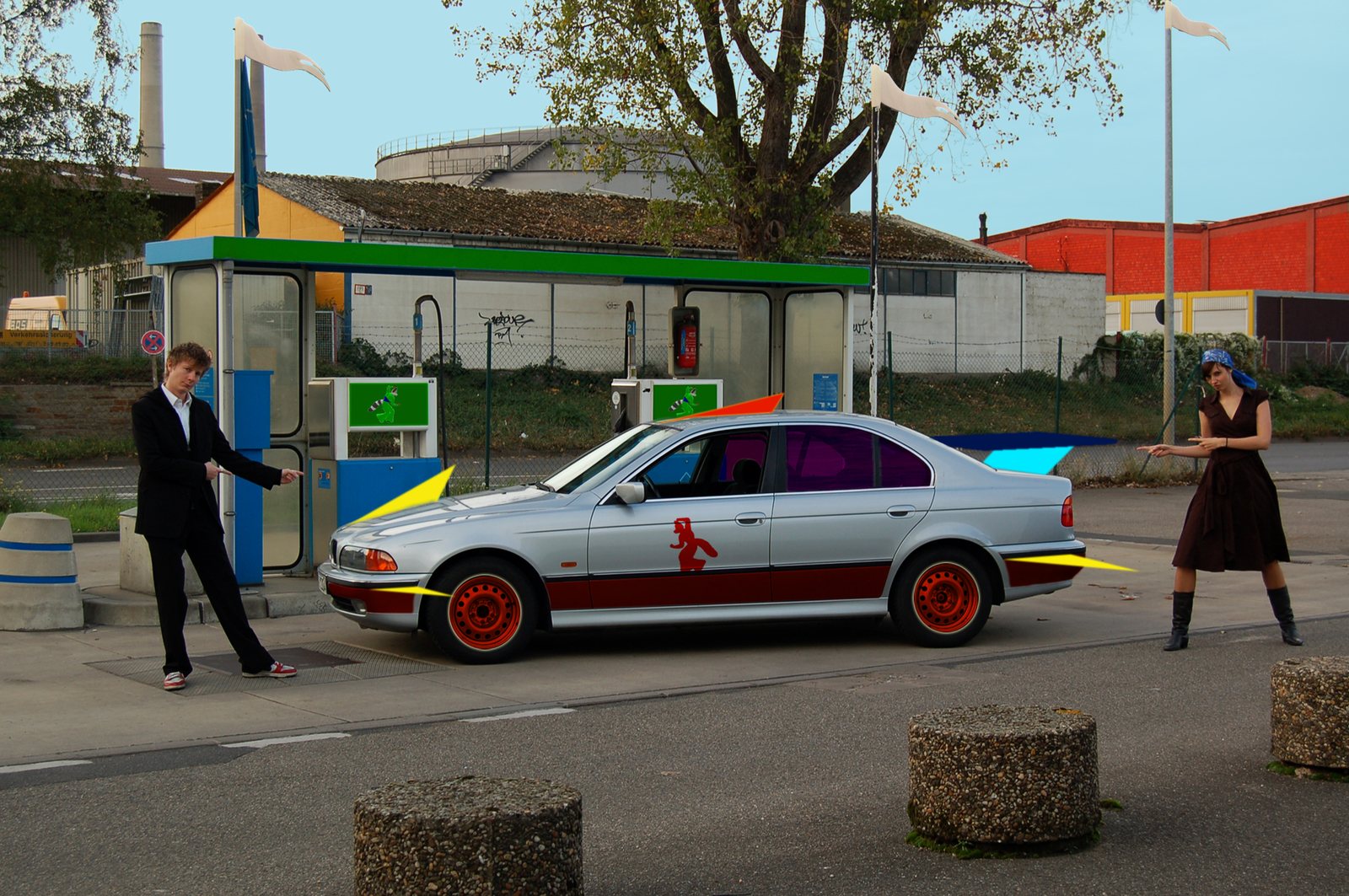 Hybrid car — a red-painted BMW at a petrol station with figures beside it