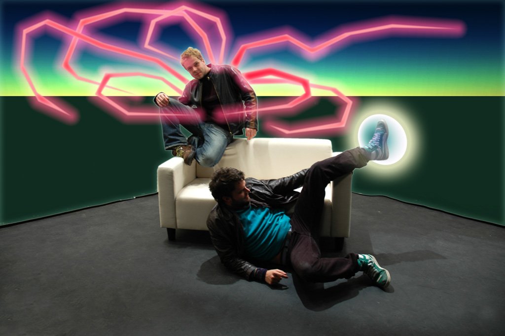 Hybrid mode — a figure on a white couch with a pink neon web