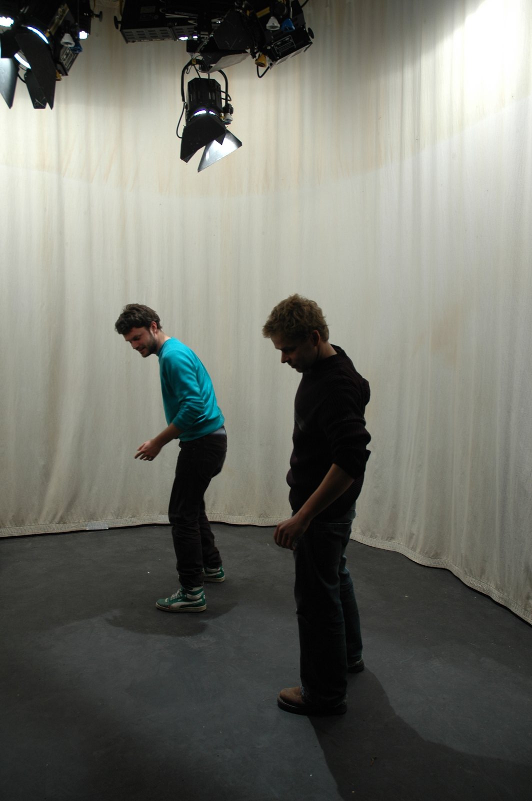The studio plate — an acrobatic pose against the backdrop