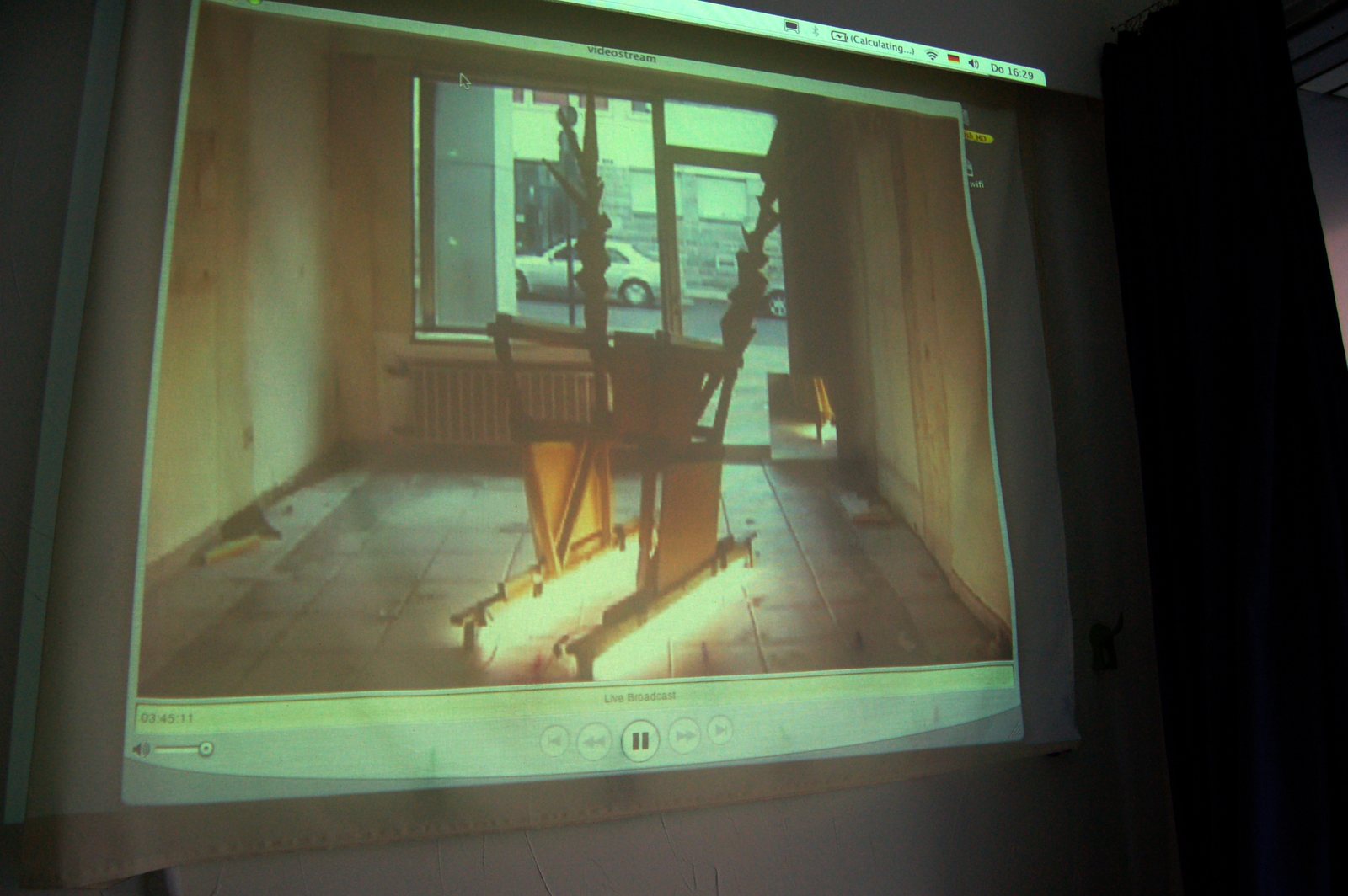 the throne nobody must sit on — a video projection of an empty throne in a darkened room
